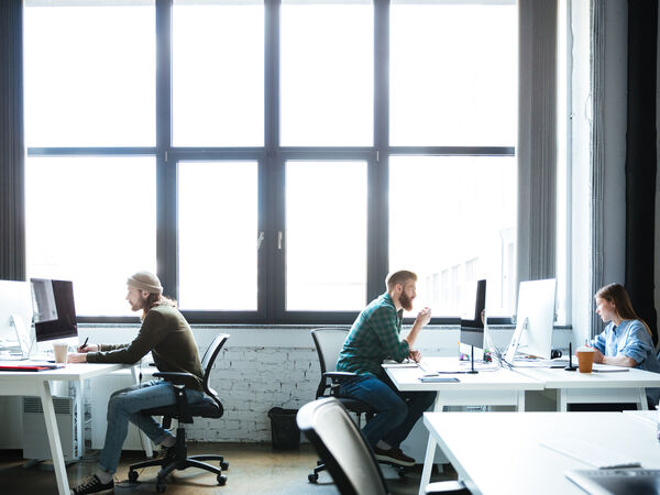 Freepik young colleagues work office using computers