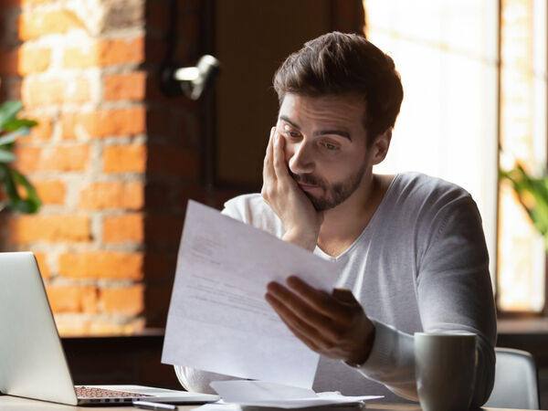 man reading paperwork