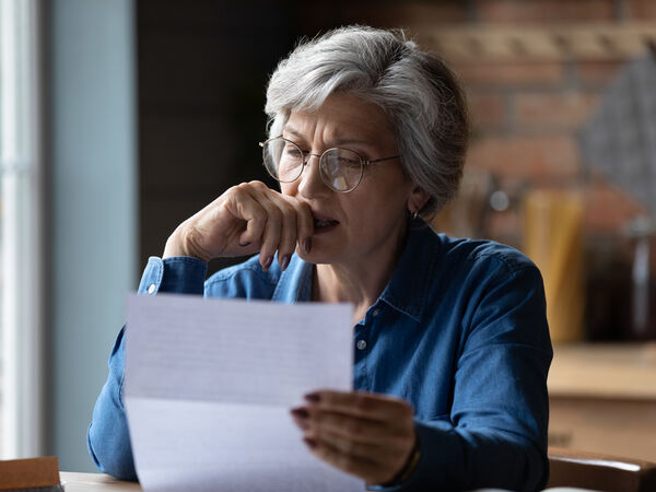 woman reading paperwork
